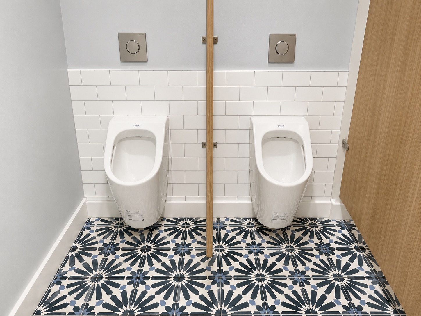 Bath with blue Moroccan mosaic floor and white subway tile